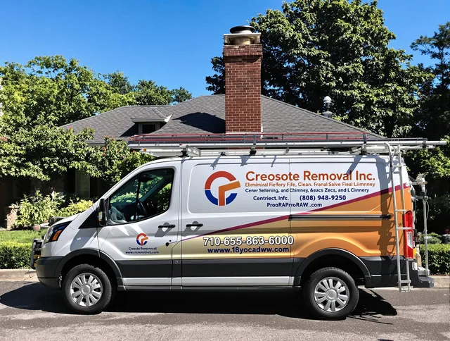 Hopkinton Chimney Sweep technician removing creosote safely in Hopkinton, MA