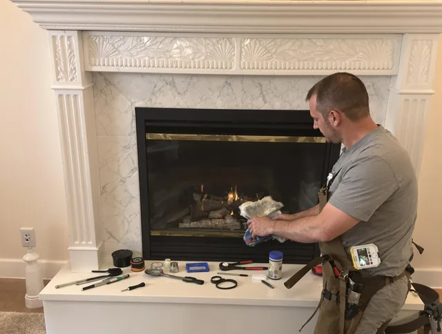 Hopkinton Chimney Sweep performing fireplace maintenance in Hopkinton, MA